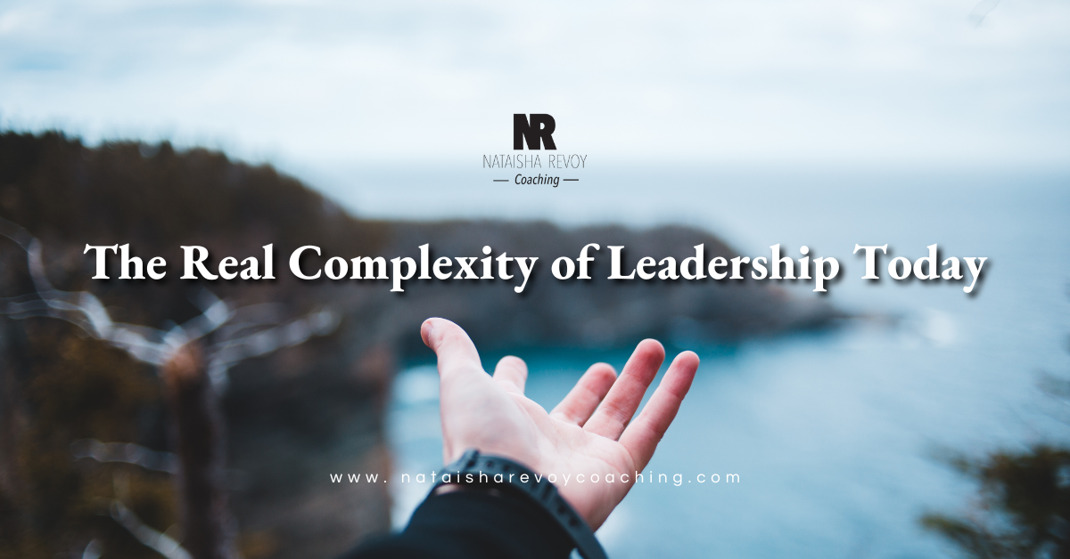 Hands reaching from mountain top with text The Real Complexity of Leadership Today