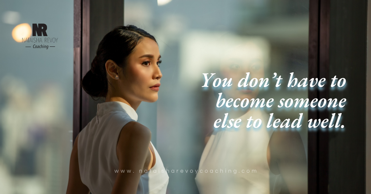 A person standing near a window in soft natural light, reflecting quietly in a calm and thoughtful moment.